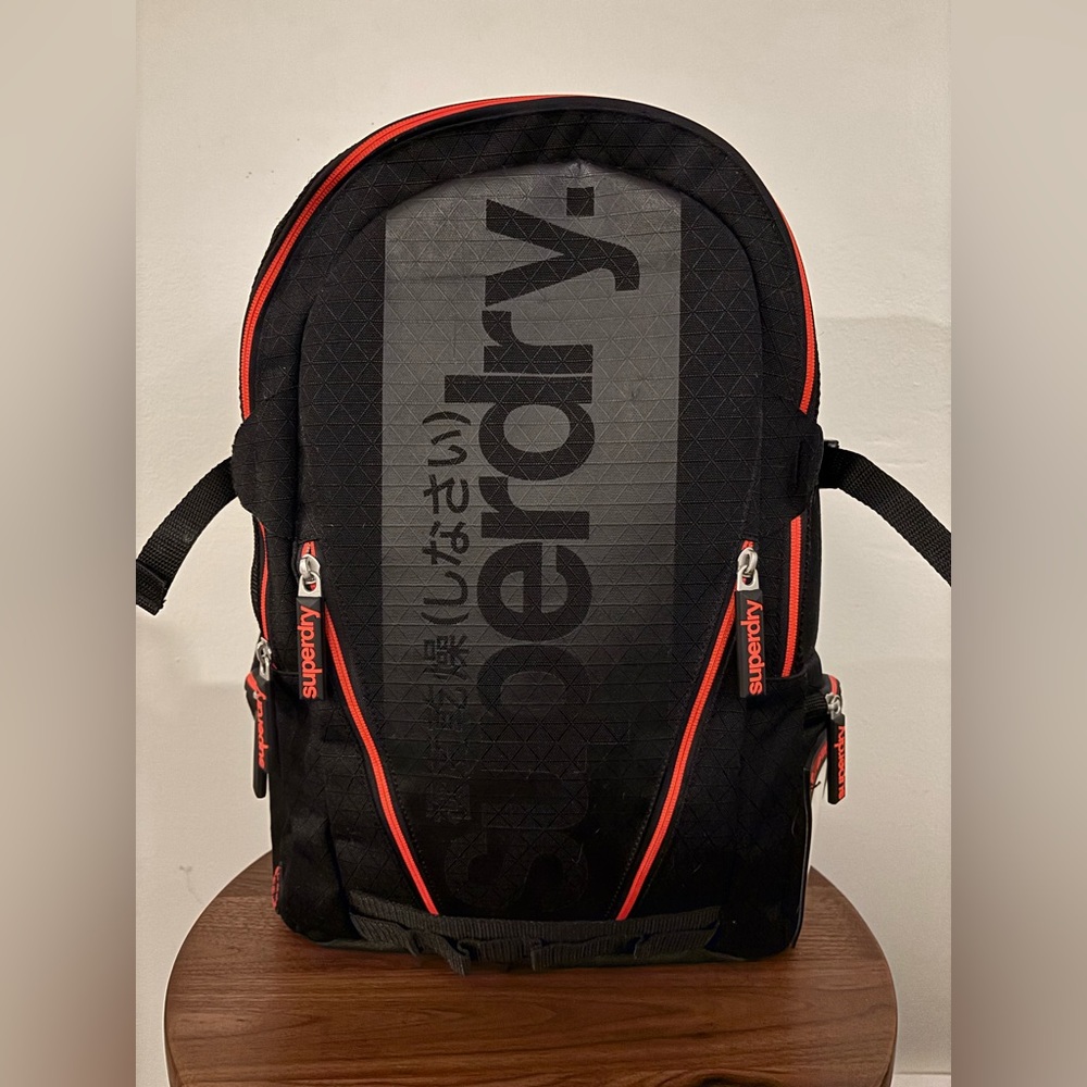 Superdry Black Label Luggage Diamond Tarp Backpack in Black with Orange Details